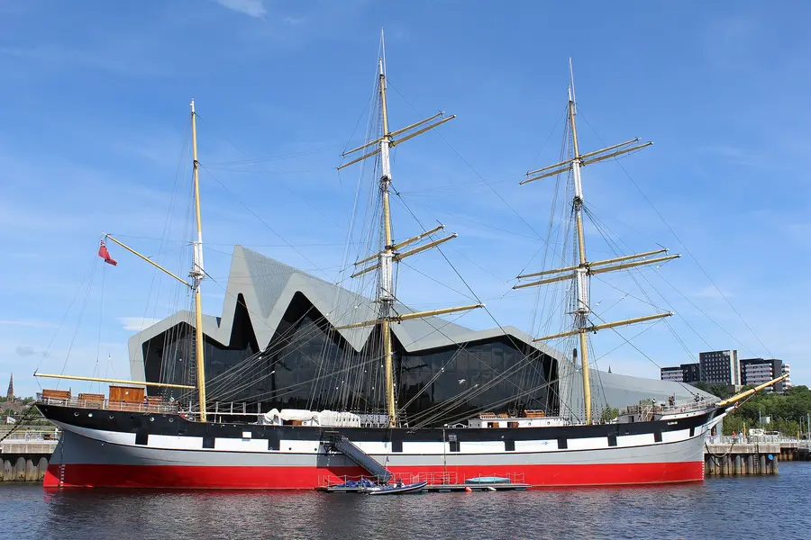 The three-masted barque Glenlee moored at a quay in Glasgow